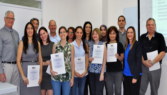 Group photo of award winners with certificates
